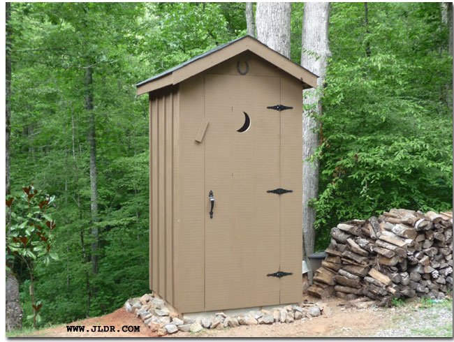 The outhouse with stain on it
