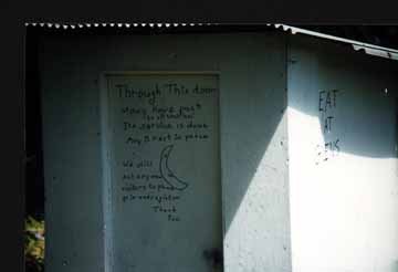 The Writing on the Door of the Outhouse