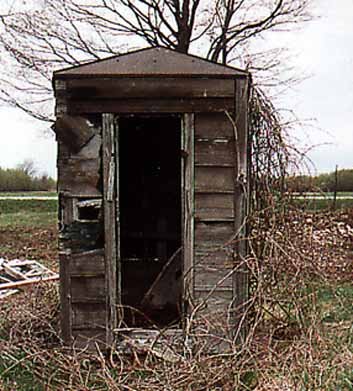 Closeup of Tin-roofed Outhouse