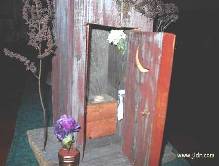 Inside the intricate model outhouse