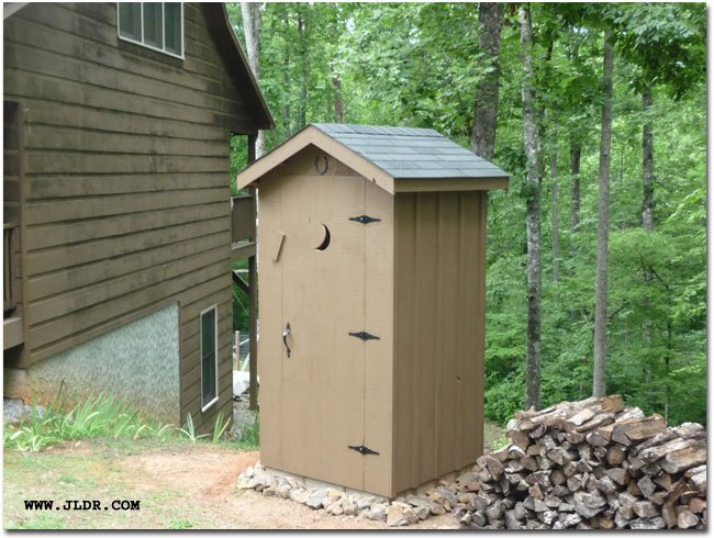 The outhouse with stain on it