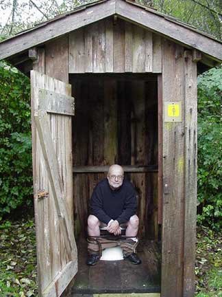 A man in the women's outhouse; You gotta go when you gotta go!