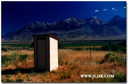 The Old Hatchery Outhouse with the Idaho Mountains in the Background