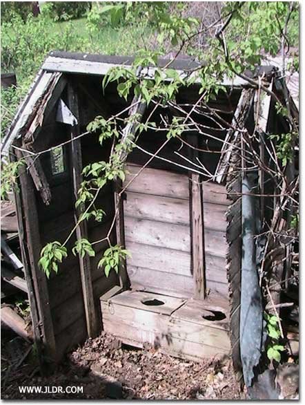 Outhouse before restoration
