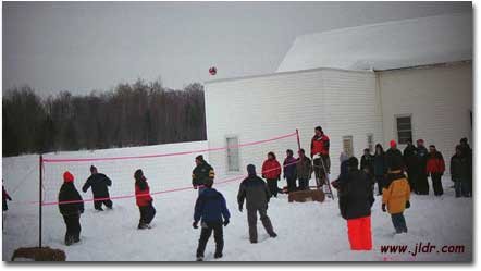 Check out a volleyball game being played on top of a few feet of snow!