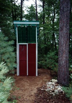 The completed Outhouse with the half moon in the door