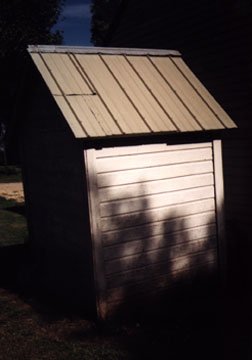 Right side of the Outhouse showing the Tin Roof